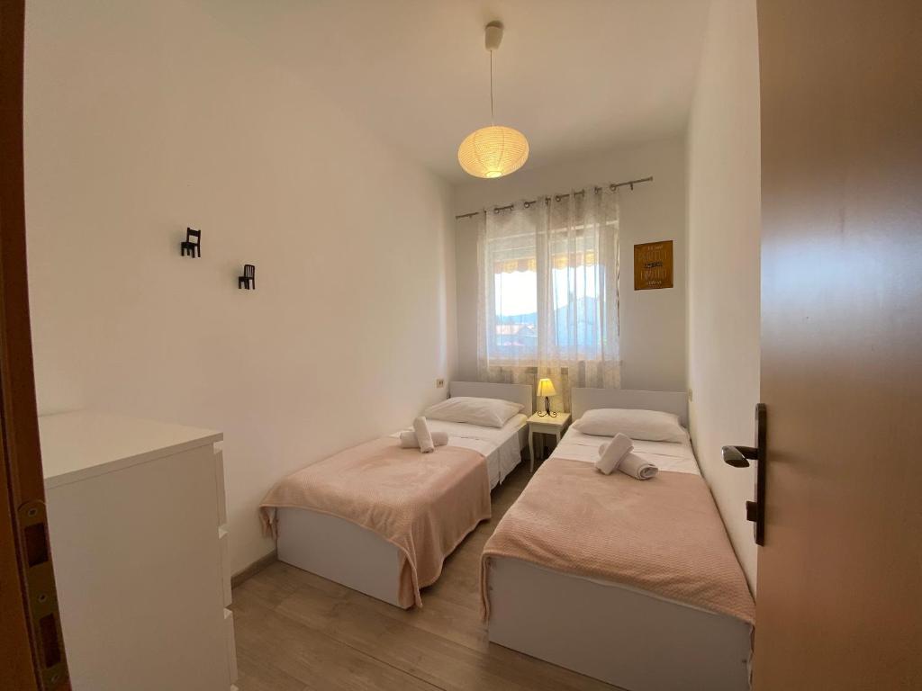 Postel nebo postele na pokoji v ubytování Apartments A&A