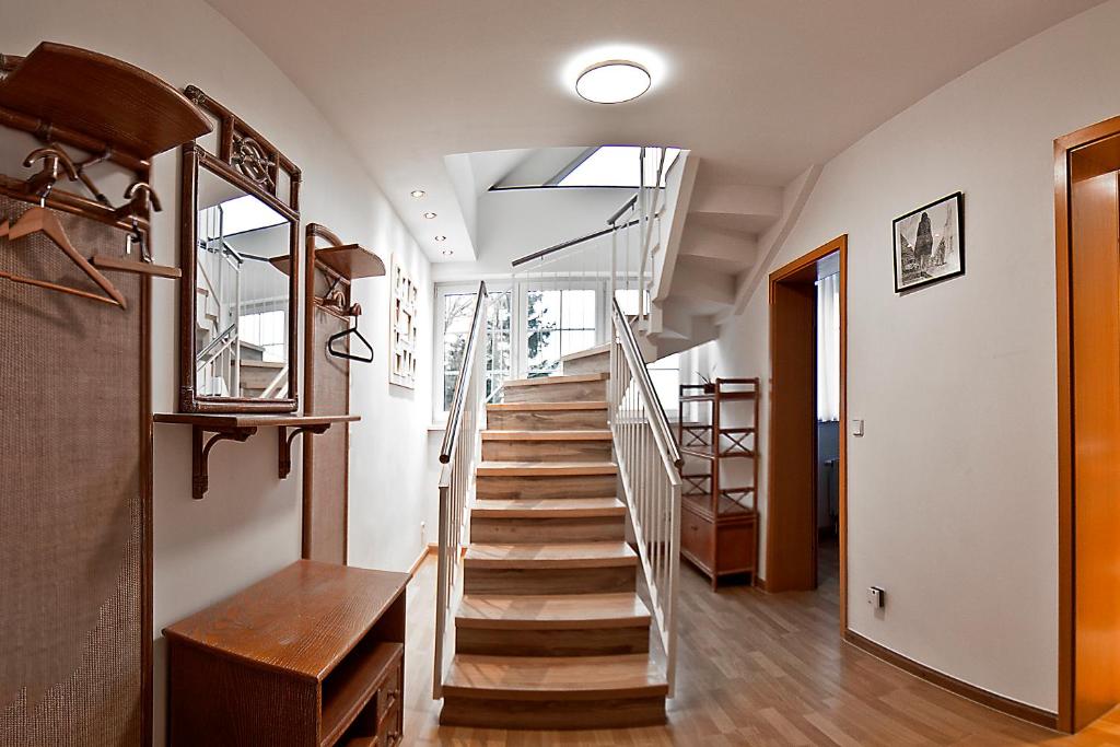 a staircase in a house with a glass railing at Haus Müritz, 14 Roter Milan in Zielow