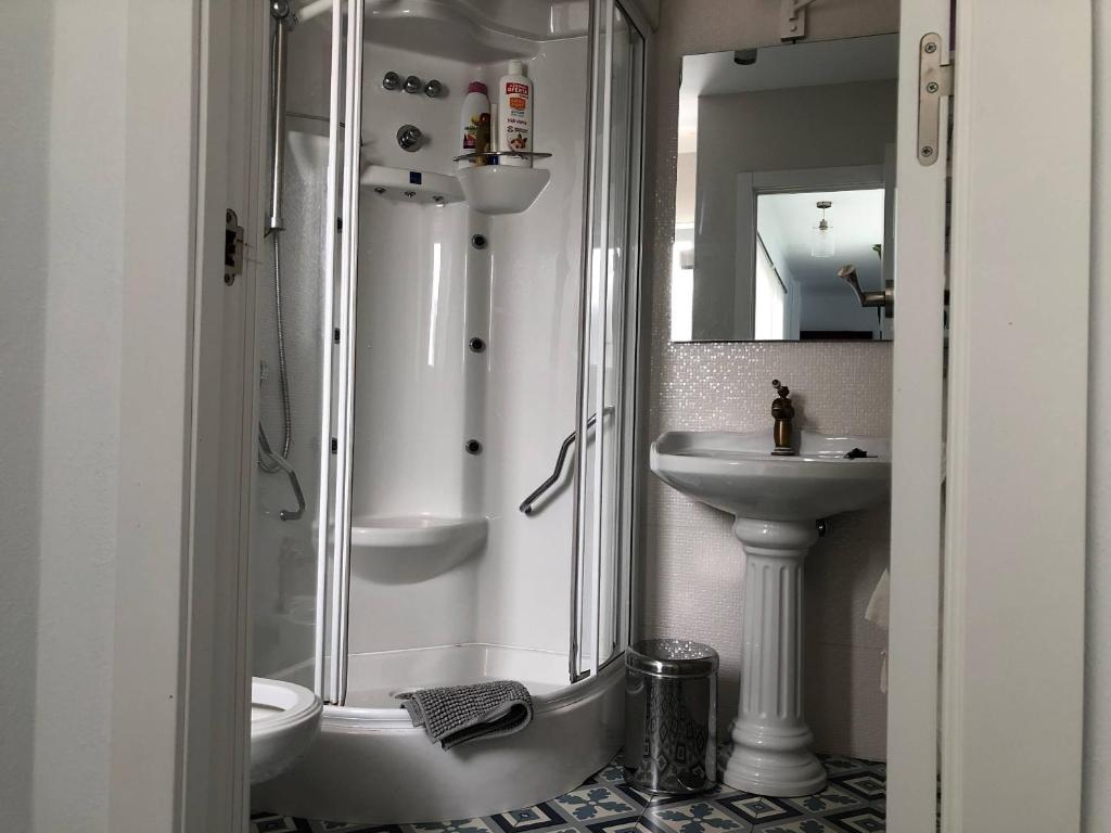 a bathroom with a shower and a sink at ABA DALÍ in Conil de la Frontera