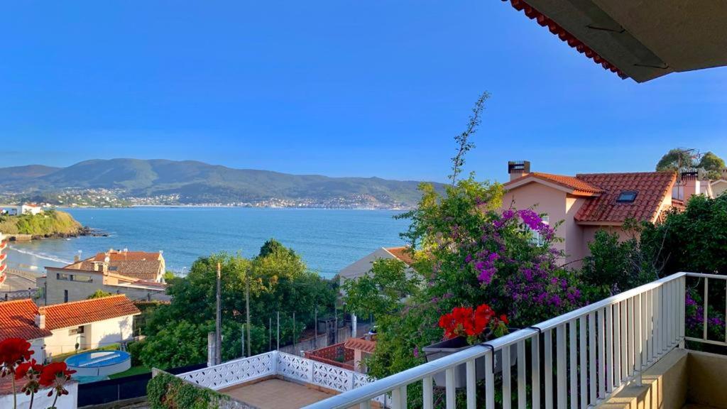 a balcony with a view of the water at Casa a 2 minutos andando a la playa de Panxón in Nigrán