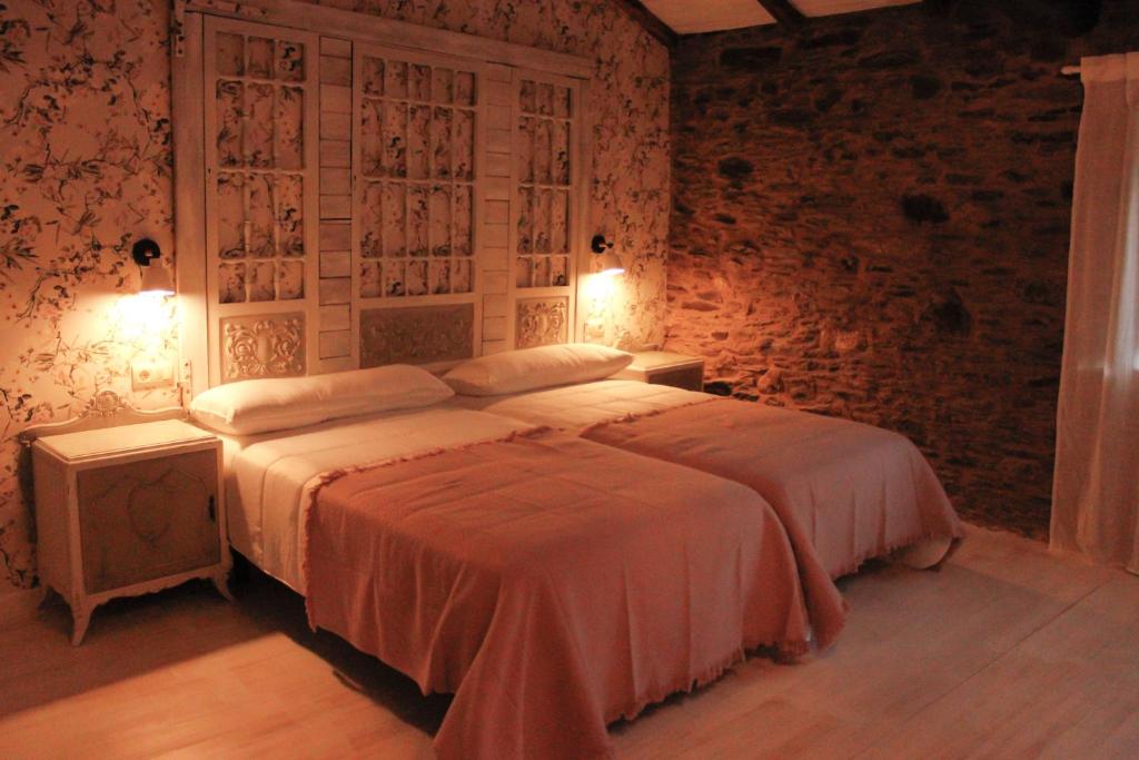 Postel nebo postele na pokoji v ubytování Casa Meiga