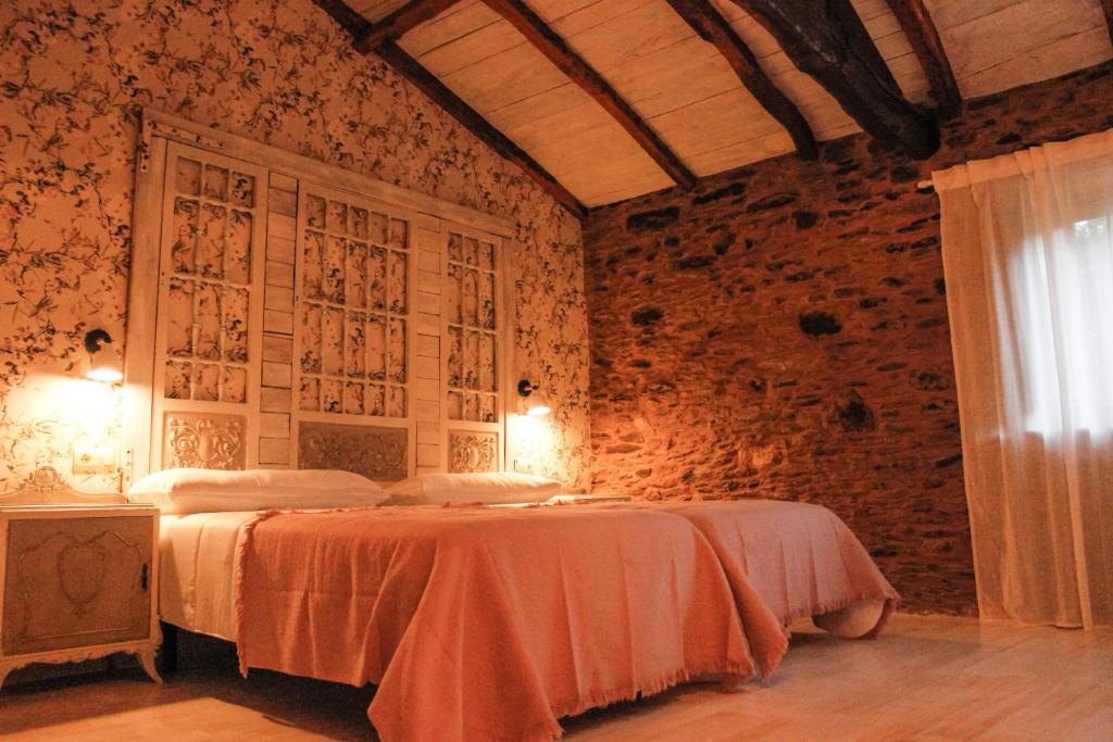 Postel nebo postele na pokoji v ubytování Casa Meiga