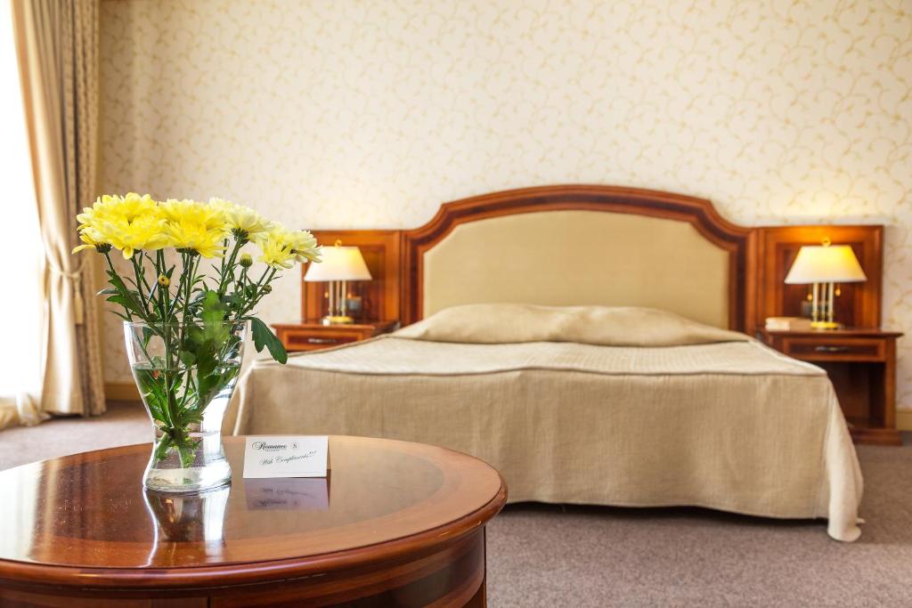 Postel nebo postele na pokoji v ubytování Romance Hotel and Family Suites