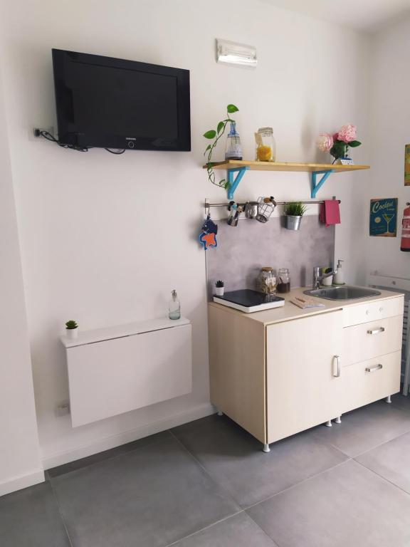 TV a/nebo společenská místnost v ubytování PEONIA 2 posti Wi-Fi AC free park Jacuzzi
