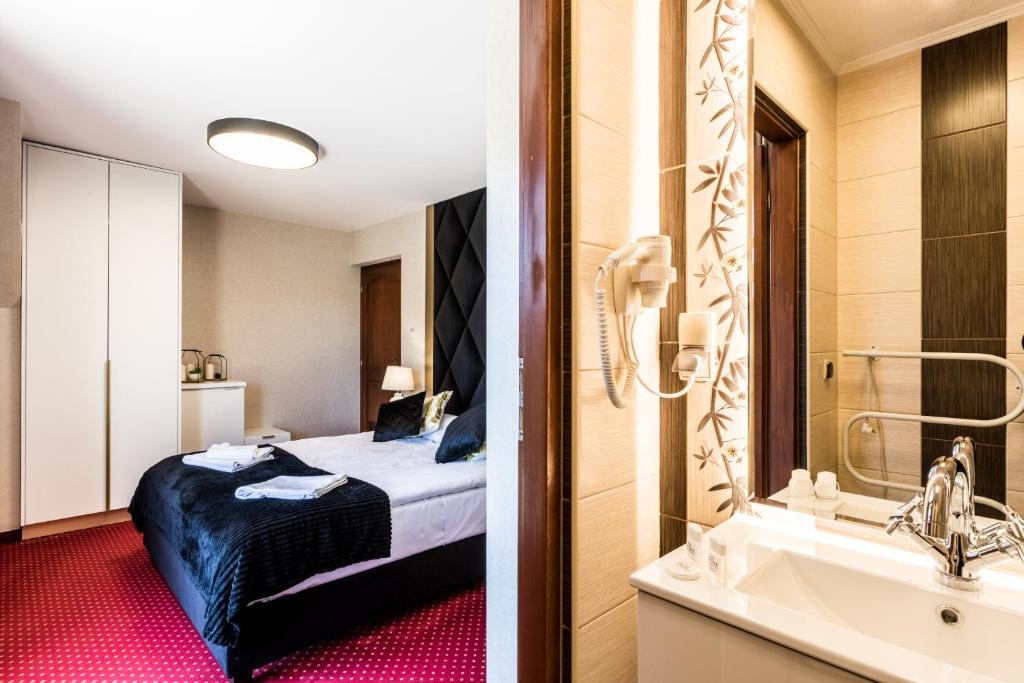 Posteľ alebo postele v izbe v ubytovaní Dworek pod Giewontem - Jacuzzi & Sauna