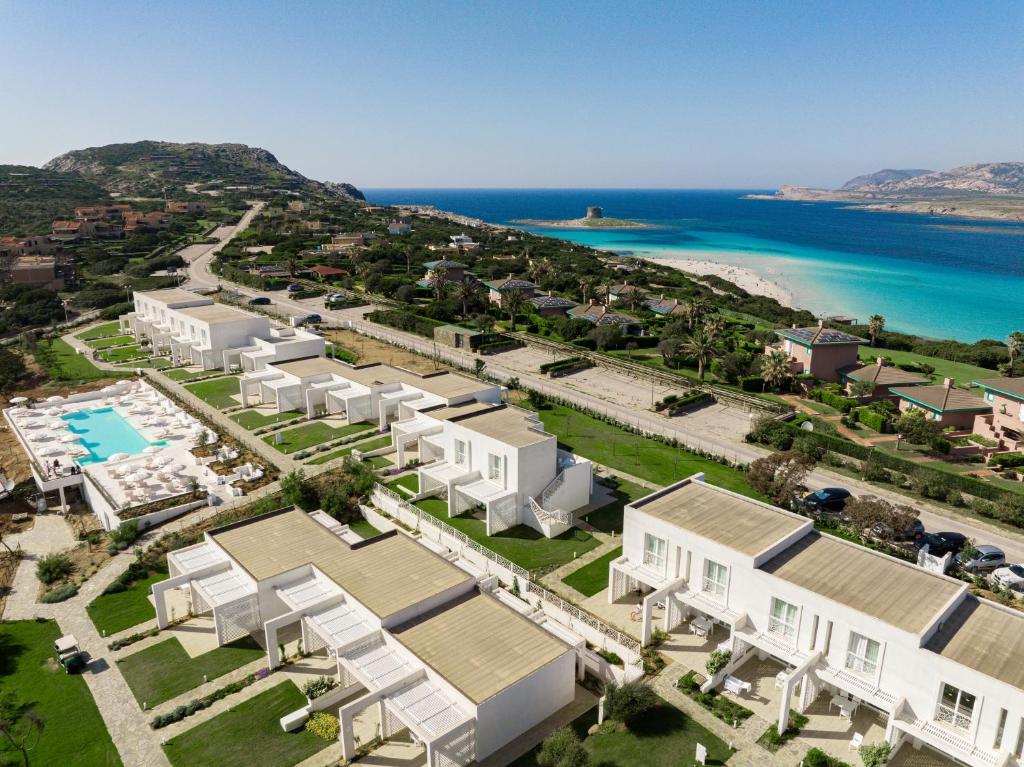 an aerial view of a resort with the ocean at Capo Falcone Charming Apartments in Stintino