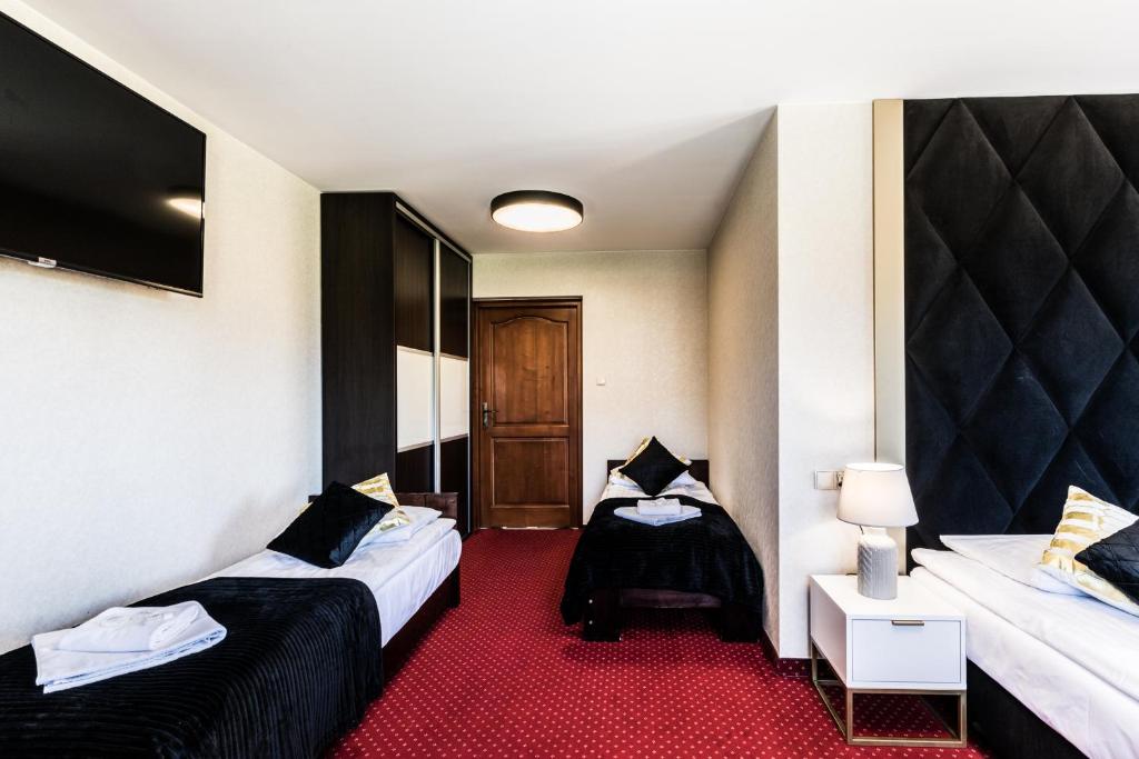 Posteľ alebo postele v izbe v ubytovaní Dworek pod Giewontem - Jacuzzi & Sauna