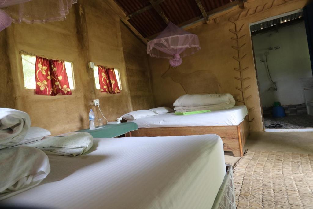 Postel nebo postele na pokoji v ubytování Wild Planet Eco Retreat