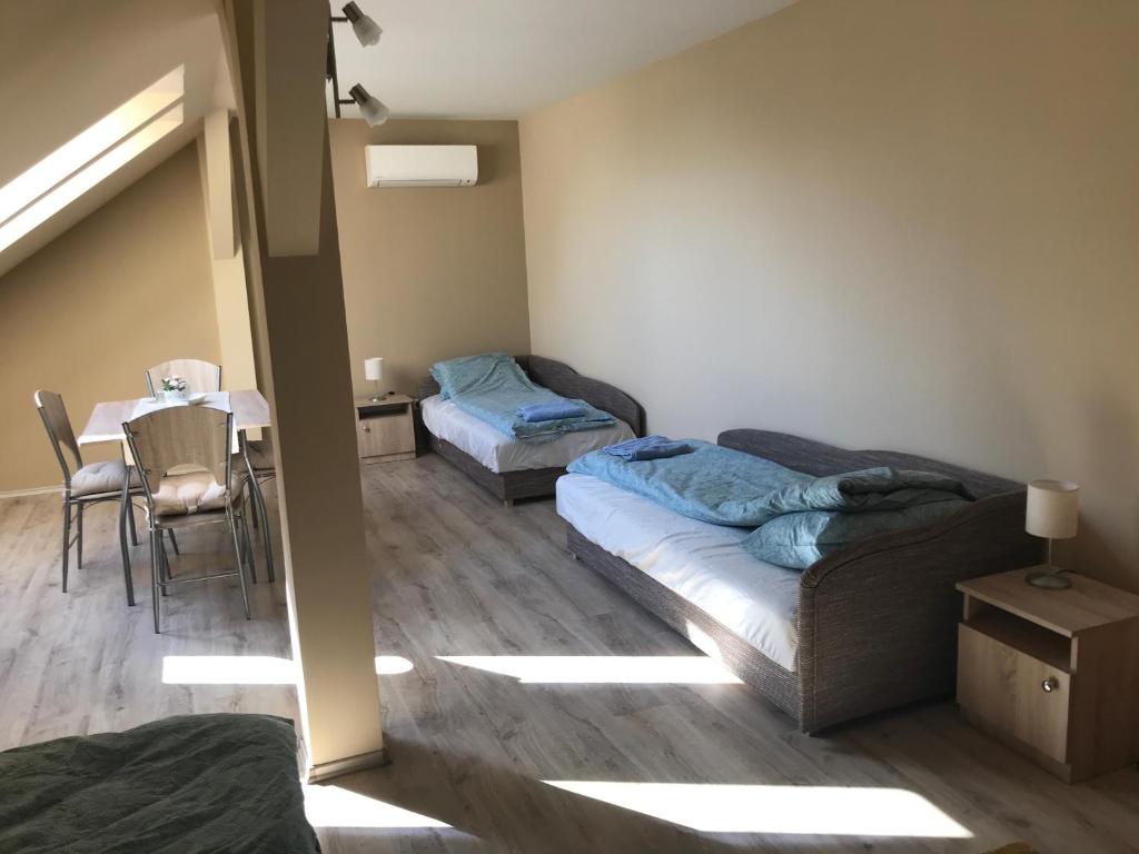 Postel nebo postele na pokoji v ubytování Bencsik Vendégház
