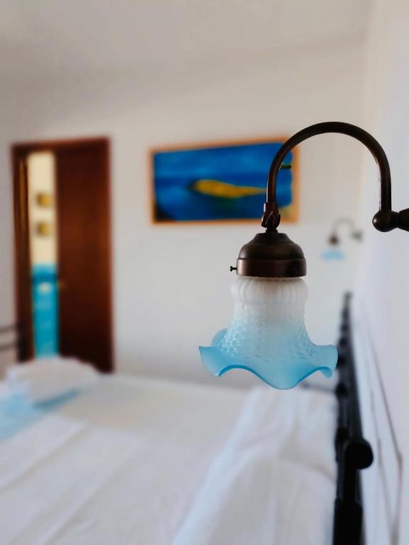 Postel nebo postele na pokoji v ubytování B&B Tre - Rooms & Relax