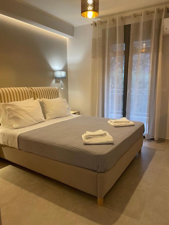 Łóżko lub łóżka w pokoju w obiekcie Iris Villas Complex