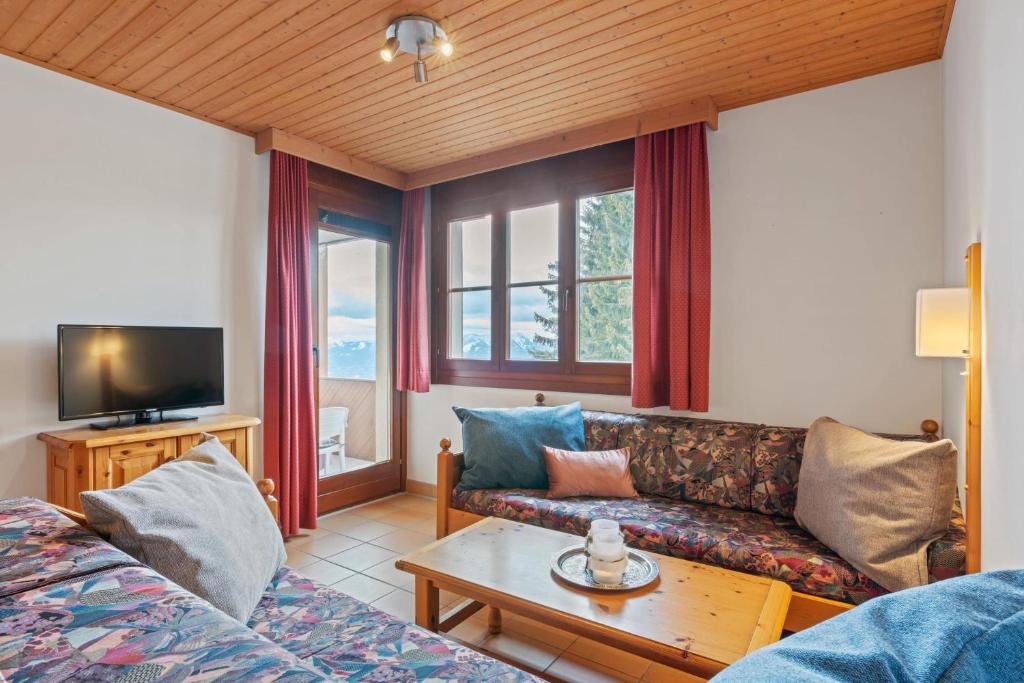 TV a/nebo společenská místnost v ubytování Apartment 2205 Kanzelhöhe