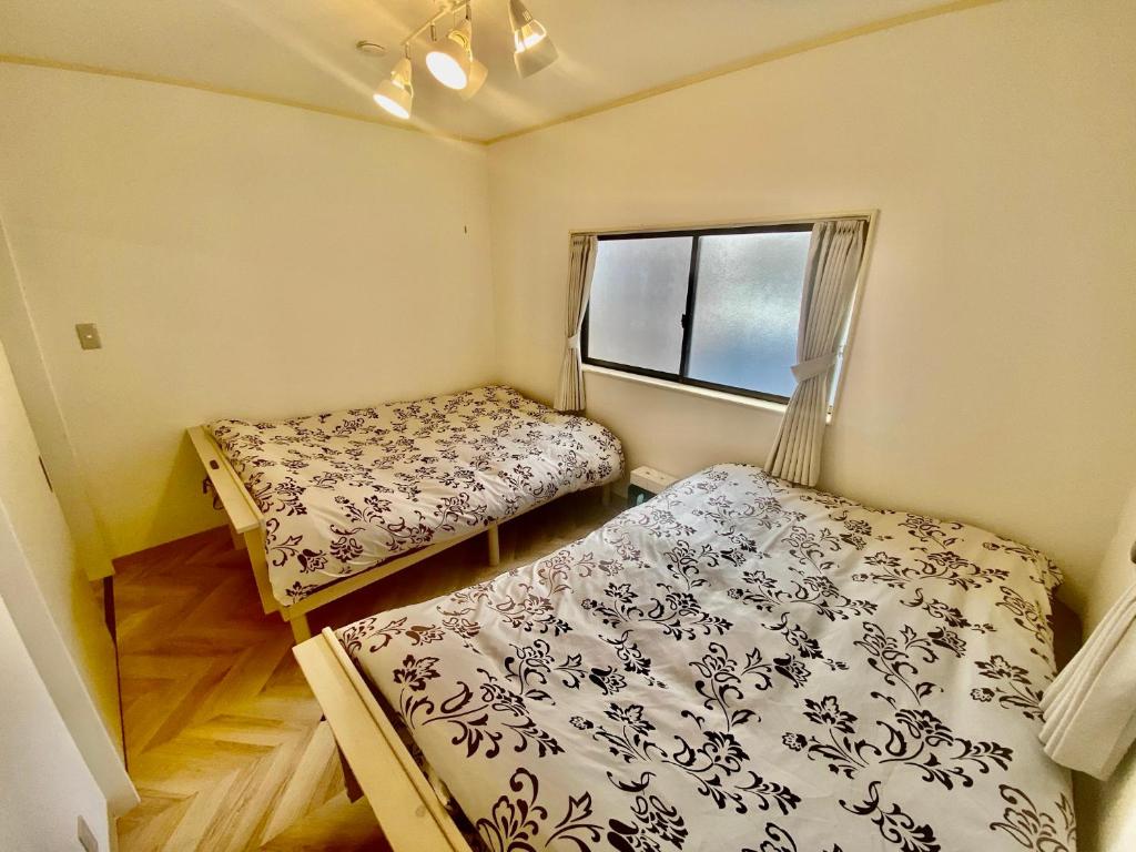 Postel nebo postele na pokoji v ubytování ARS HOTEL Utsunomiya フロア貸切