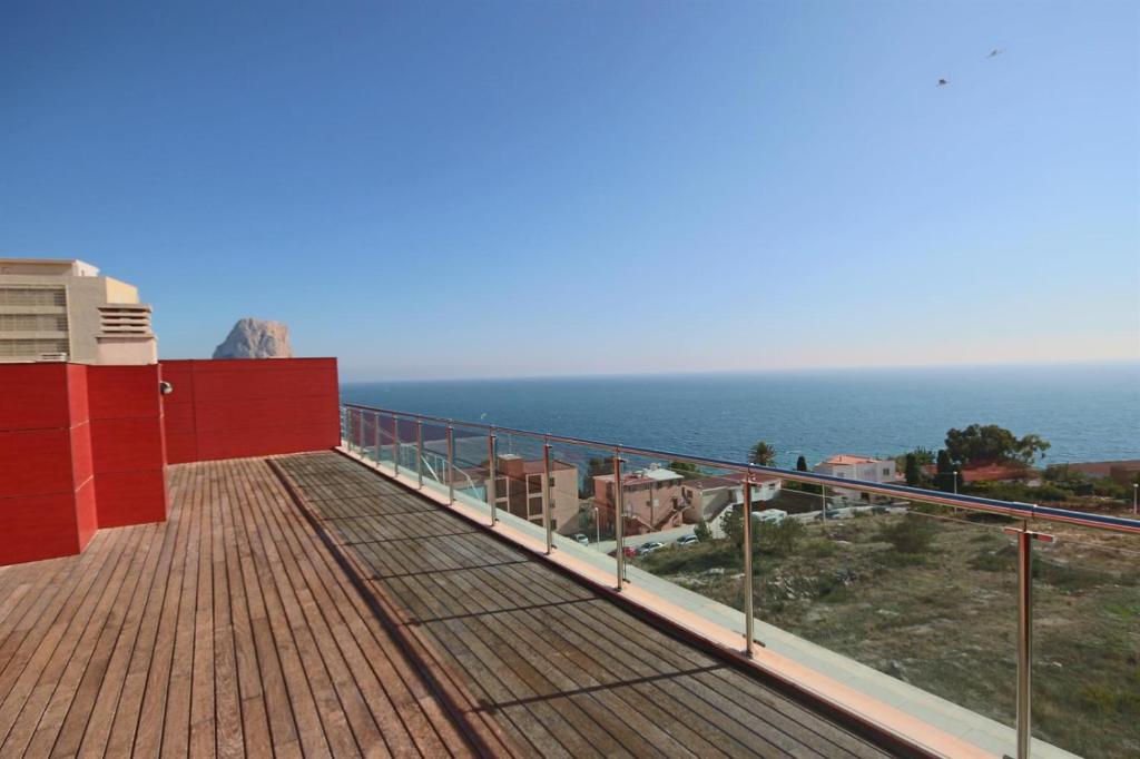 a balcony with a view of the ocean at Homeincalpe Borumbot in Calpe