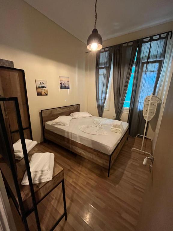 A bed or beds in a room at Thessaloniki Loxandra's House