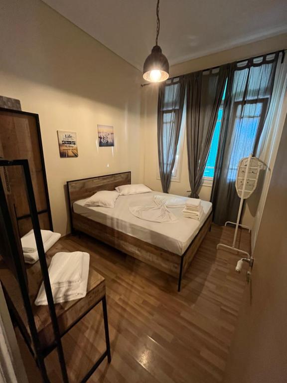 A bed or beds in a room at Thessaloniki Loxandra's House