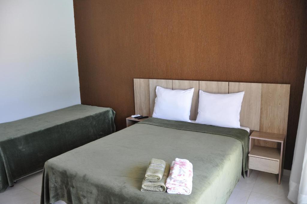 Postel nebo postele na pokoji v ubytování Pousada Suites Bougainville