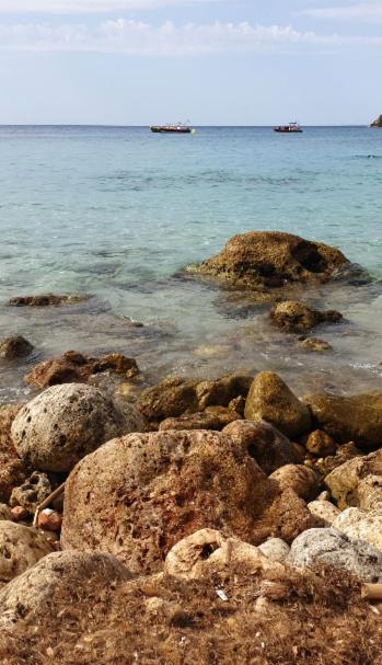 a group of rocks on the shore of the ocean at Beach house Cala Morlanda in S'Illot