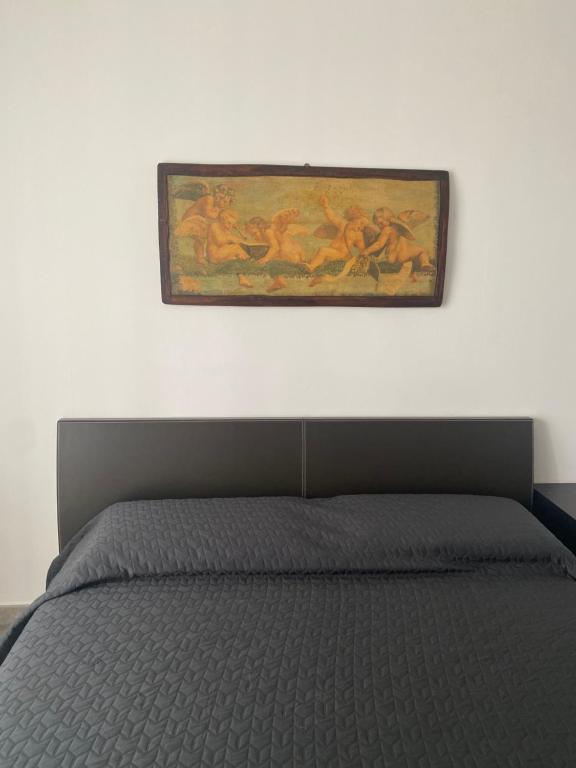 A bed or beds in a room at Le stanze di Mina