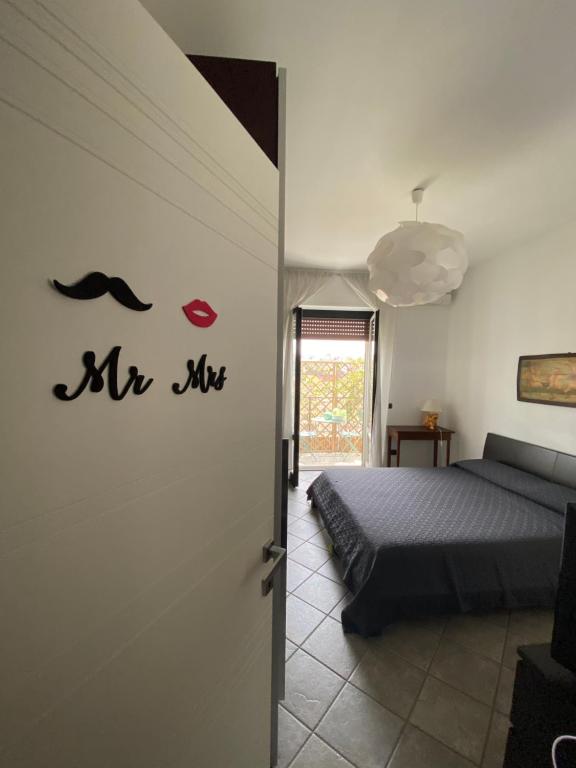 A bed or beds in a room at Le stanze di Mina