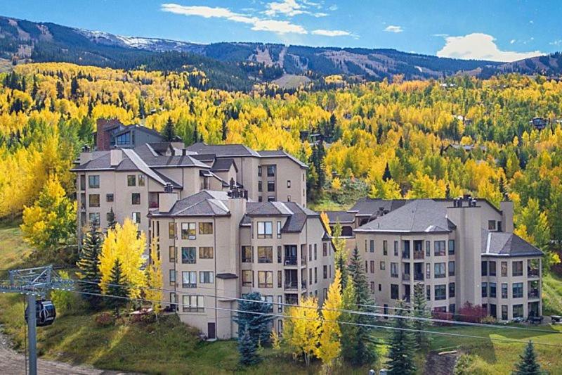 a large apartment building in the middle of a mountain at Snowmass Village, 3 Bedroom at Chamonix Ski-in Ski-out in Snowmass Village