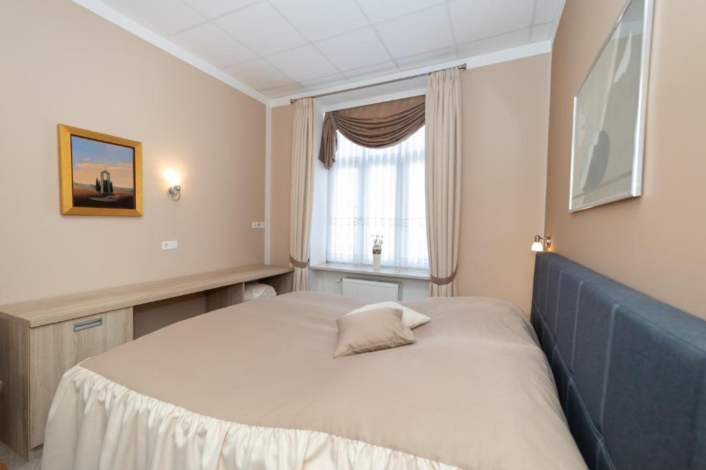 Postel nebo postele na pokoji v ubytování Apartments and Rooms kod Eli