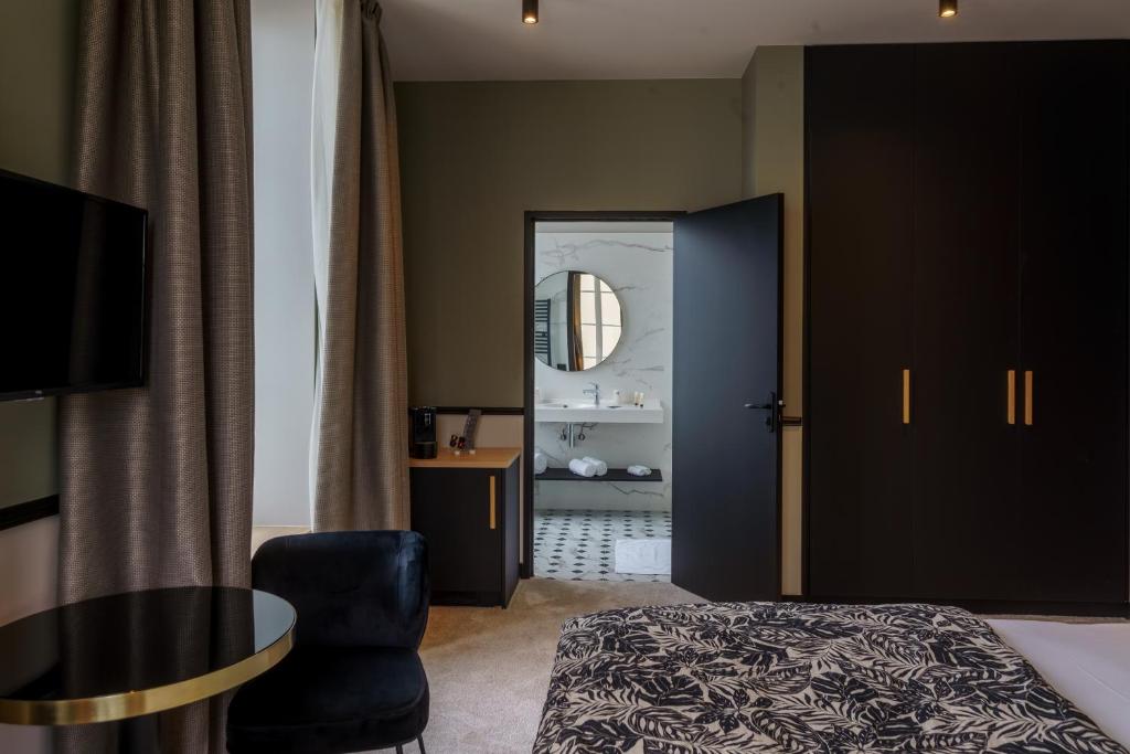 Posteľ alebo postele v izbe v ubytovaní Hotel de la Plage