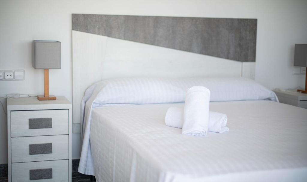 Posteľ alebo postele v izbe v ubytovaní R130 Beachfront Apartment with air conditionner