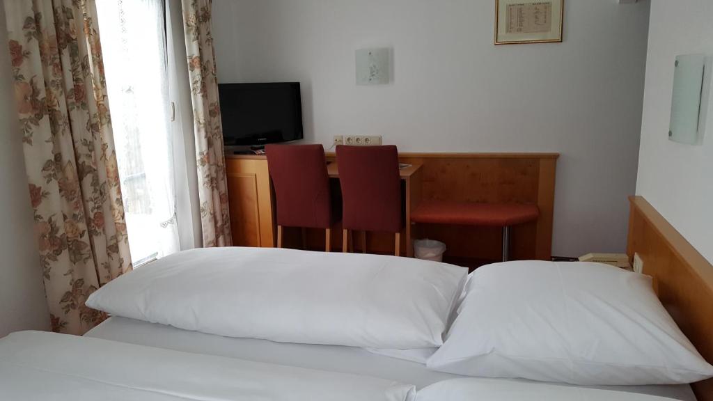 Postel nebo postele na pokoji v ubytování Arrivel am Bergson - bisher Hotel Neuner