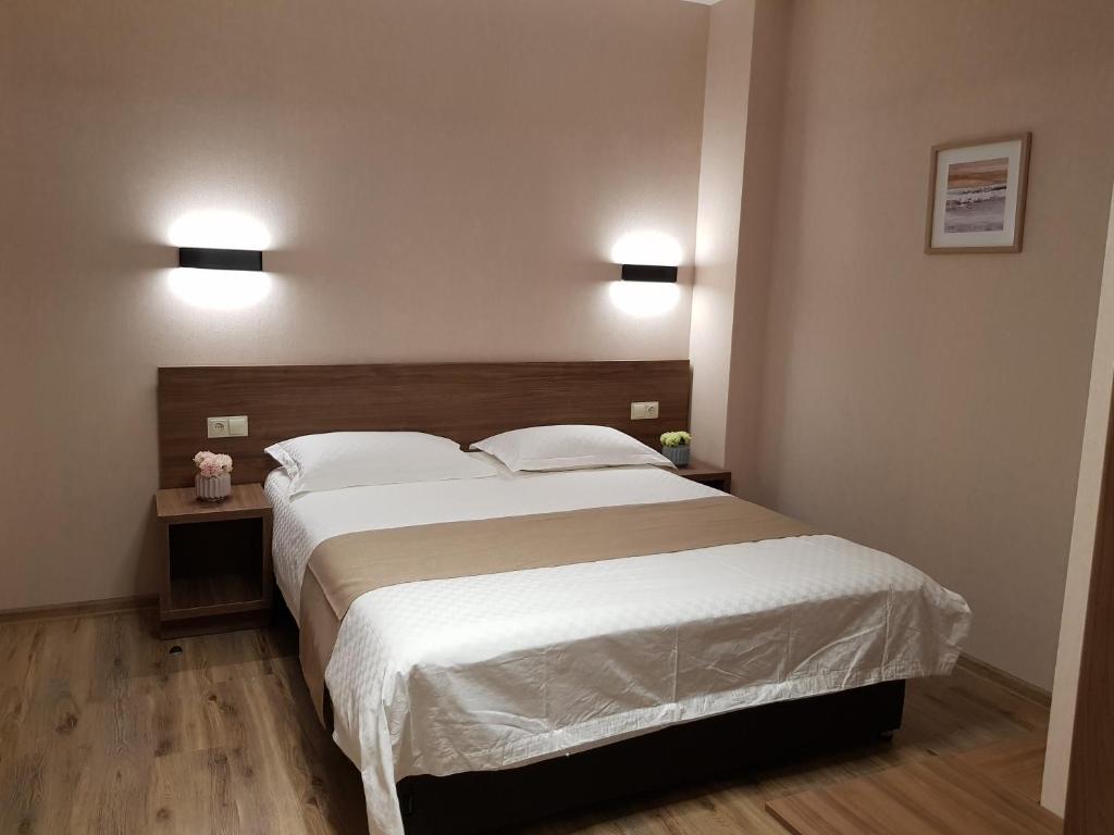 Postel nebo postele na pokoji v ubytování Bakuriani Crystal Resort Apartment