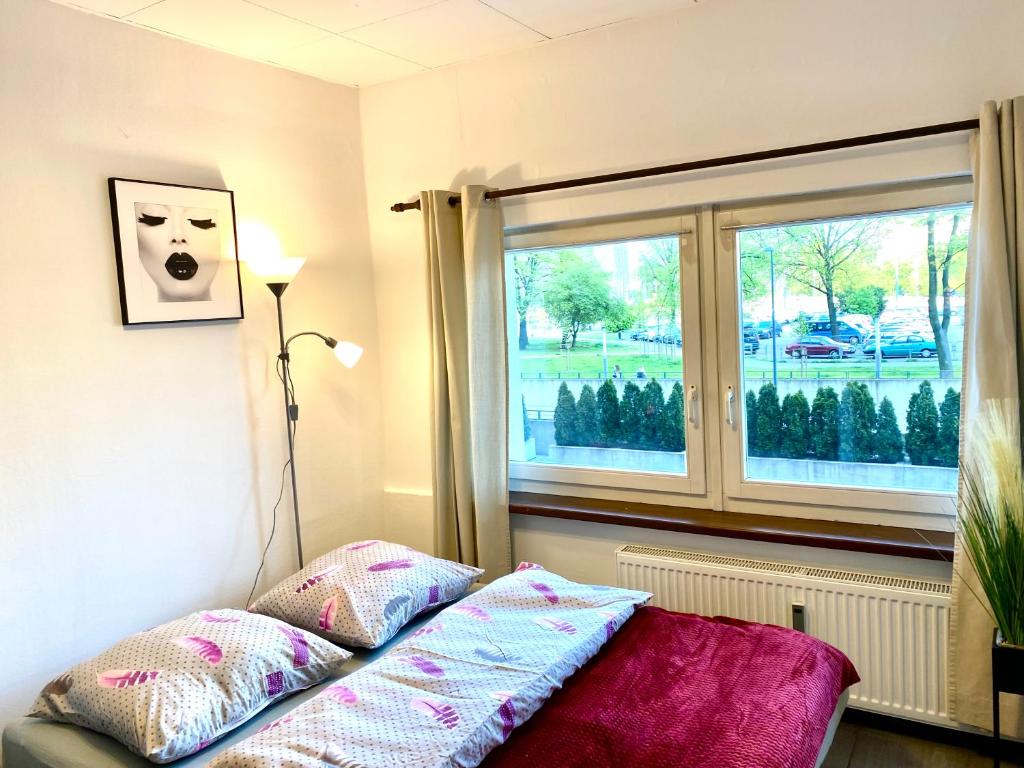 Posteľ alebo postele v izbe v ubytovaní Aparthotel Superjednostka Katowice