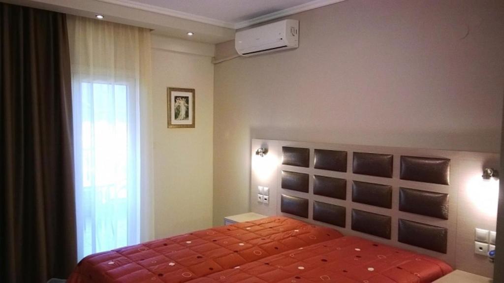 Postel nebo postele na pokoji v ubytování Gaia Studios & Apartments