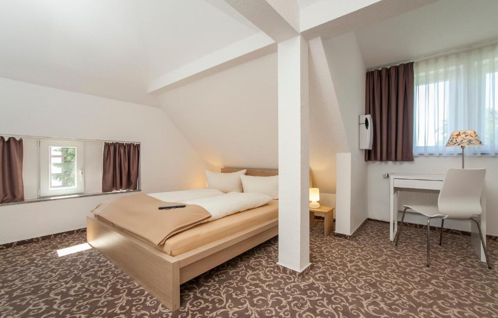Postel nebo postele na pokoji v ubytování Pension Lok-Inn