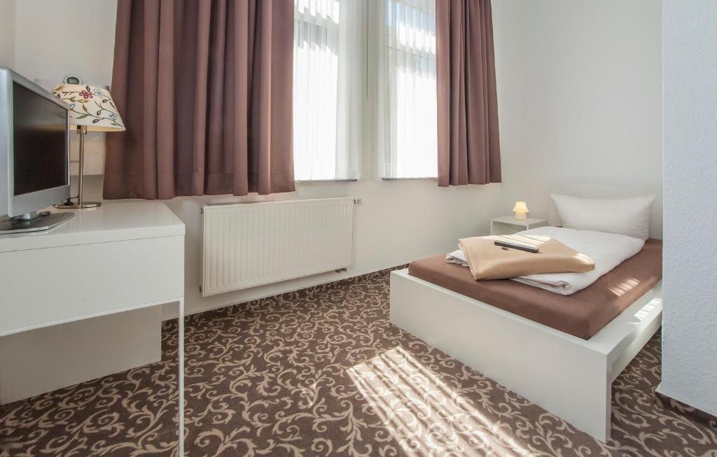 Postel nebo postele na pokoji v ubytování Pension Lok-Inn