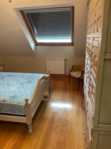 A bed or beds in a room at Apartamentos Villa Nustre