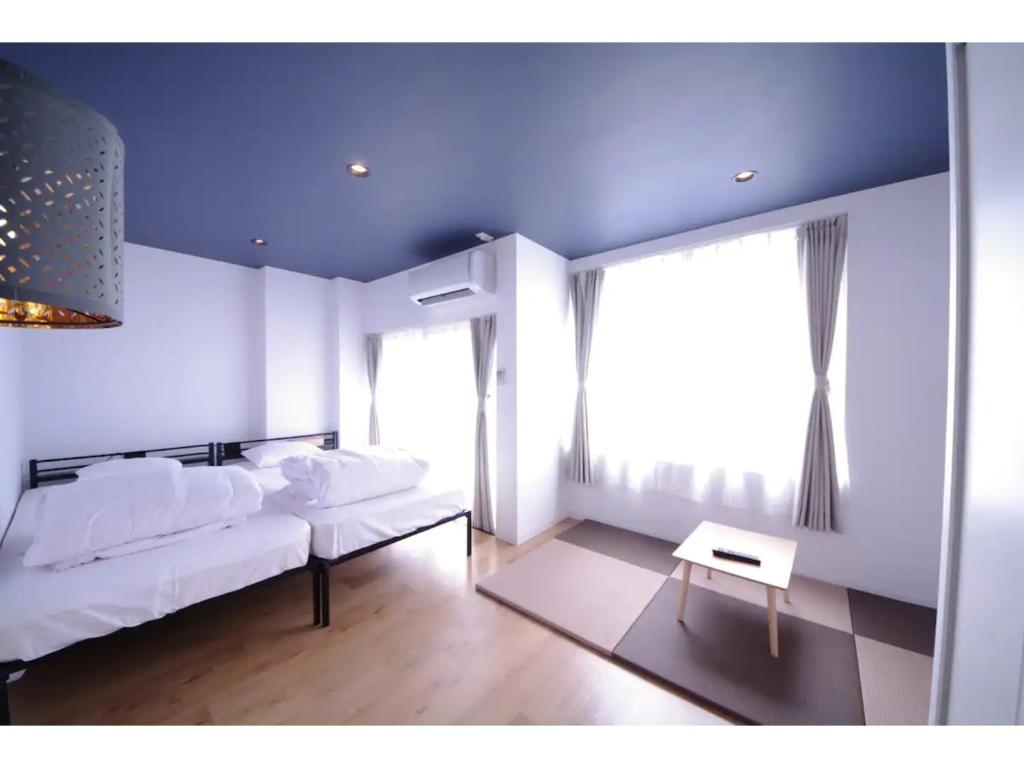 Ένα ή περισσότερα κρεβάτια σε δωμάτιο στο HOTEL APT SESELA - Vacation STAY 12884