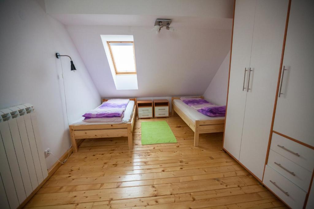 Postel nebo postele na pokoji v ubytování Vila Plamenac