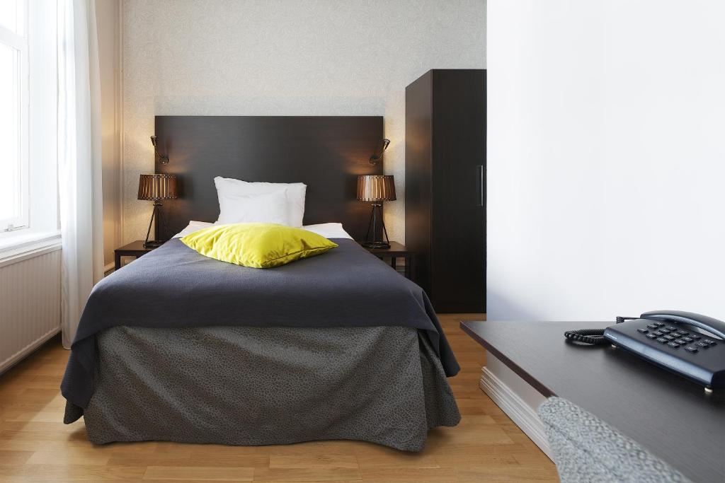 Postel nebo postele na pokoji v ubytování Home Hotel Plaza