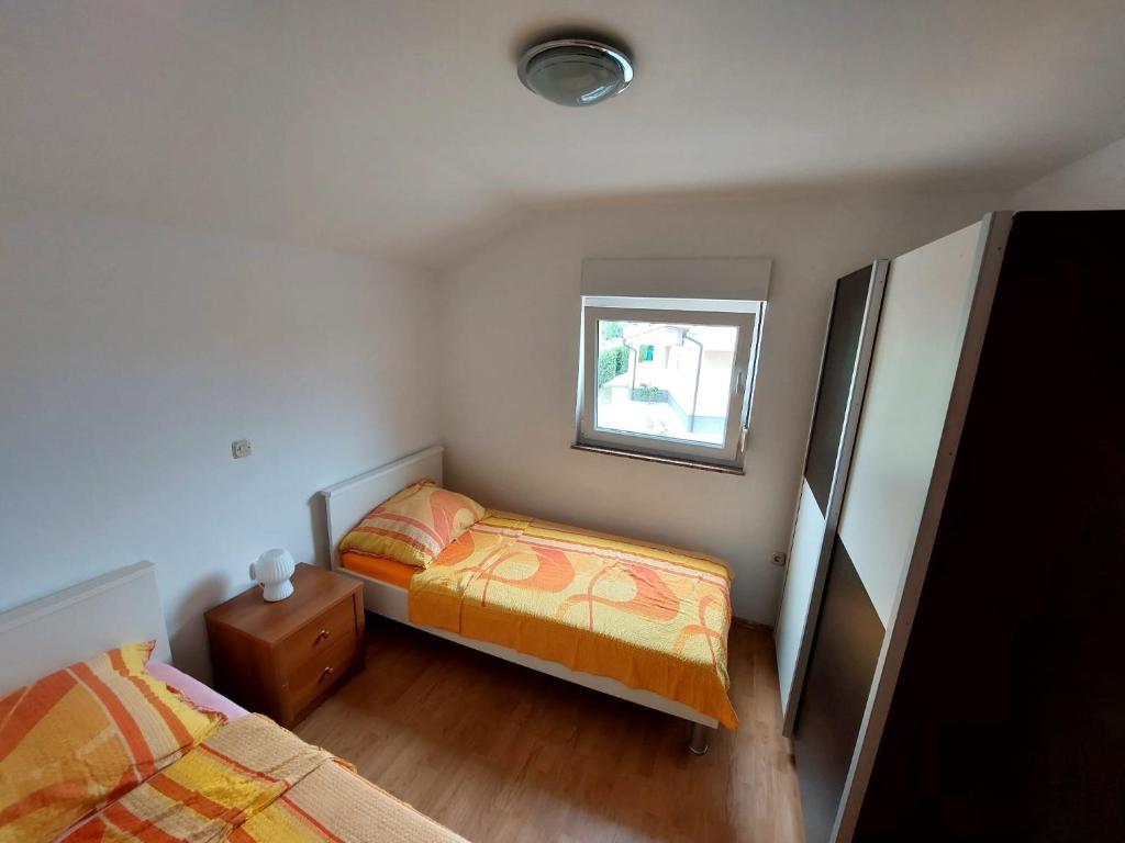 Postel nebo postele na pokoji v ubytování Apartman Željo