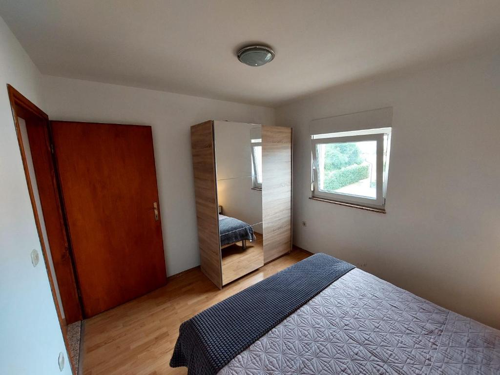 Postel nebo postele na pokoji v ubytování Apartman Željo