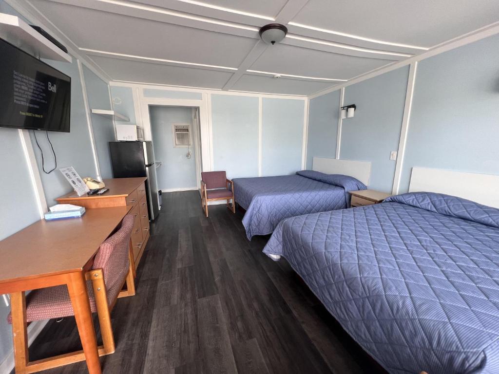 Postel nebo postele na pokoji v ubytování Elect Inn 5