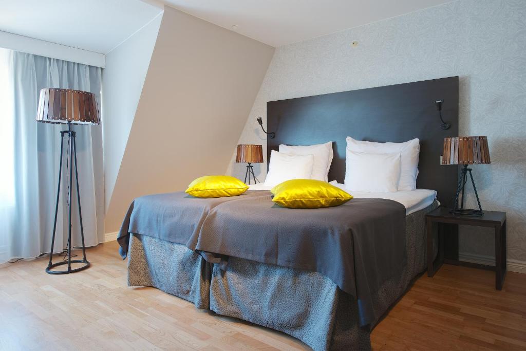 Postel nebo postele na pokoji v ubytování Home Hotel Plaza