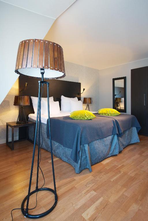 Postel nebo postele na pokoji v ubytování Home Hotel Plaza