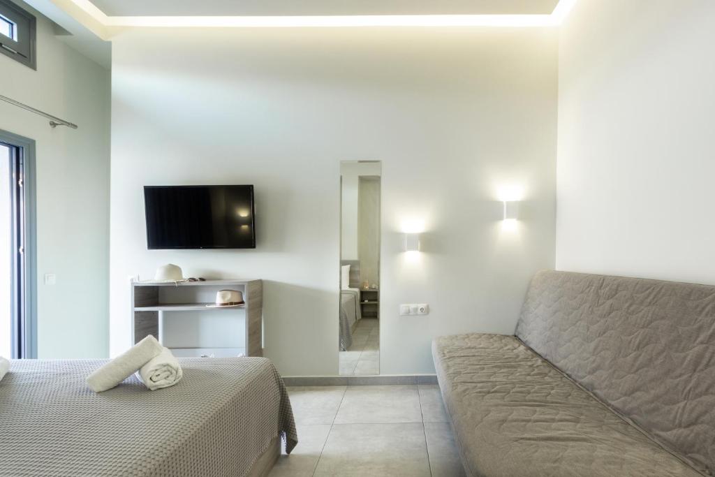 Televízia a/alebo spoločenská miestnosť v ubytovaní Summer Inn