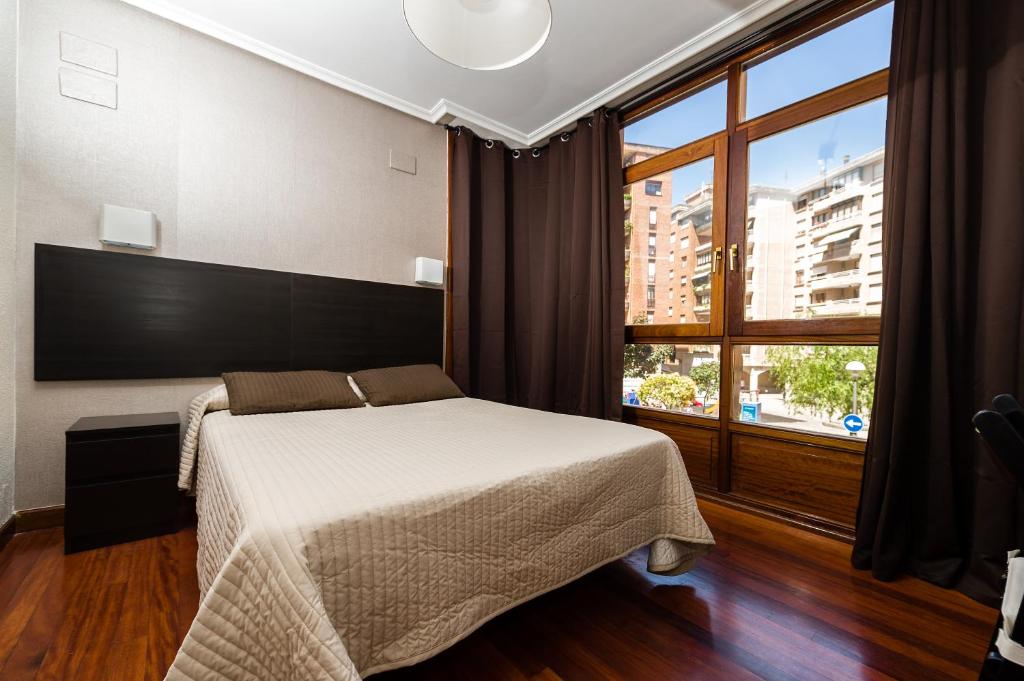 Postel nebo postele na pokoji v ubytování Alojamientos Rooms Catamarán