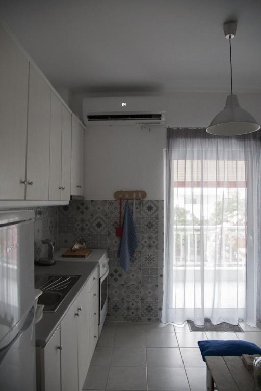 Kuchyň nebo kuchyňský kout v ubytování Grey Theros Apartments