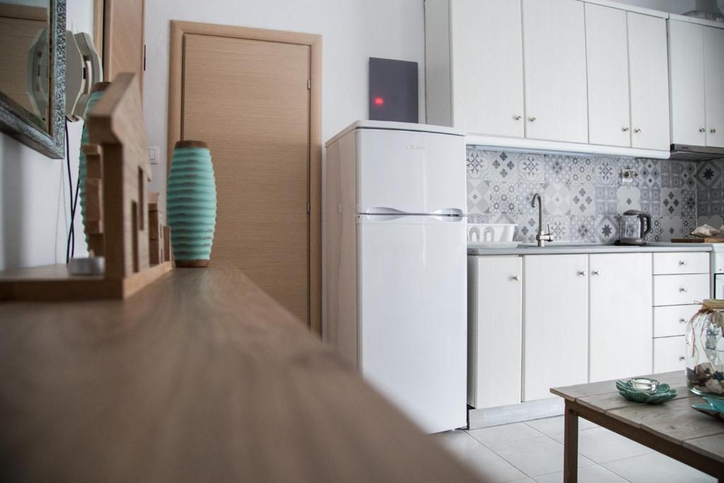 Kuchyň nebo kuchyňský kout v ubytování Grey Theros Apartments