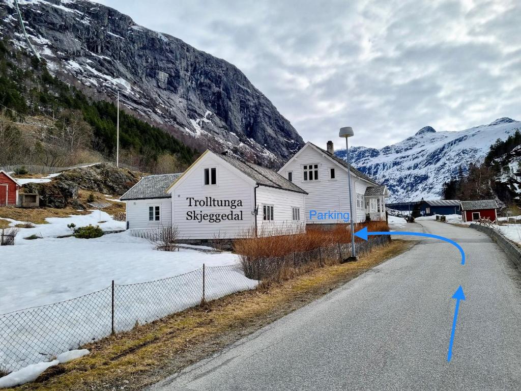 a white building on the side of a road at Trolltunga Skjeggedal in Skjeggedal