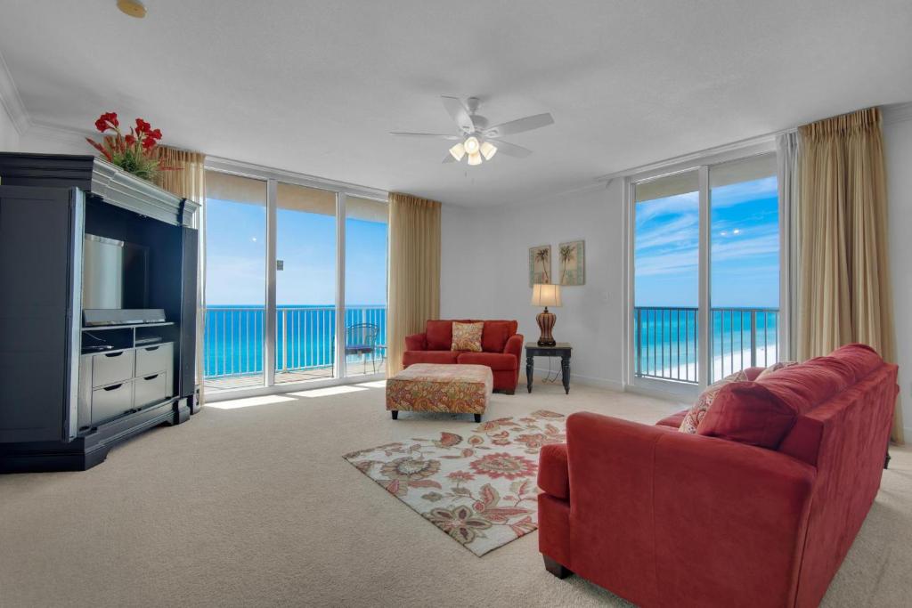 a living room with a view of the ocean at Tidewater 901 in Panama City Beach