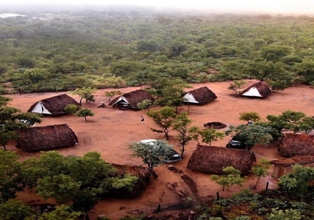 an aerial view of a village with tents and trees at Cabana Camping Jalapão in São Félix
